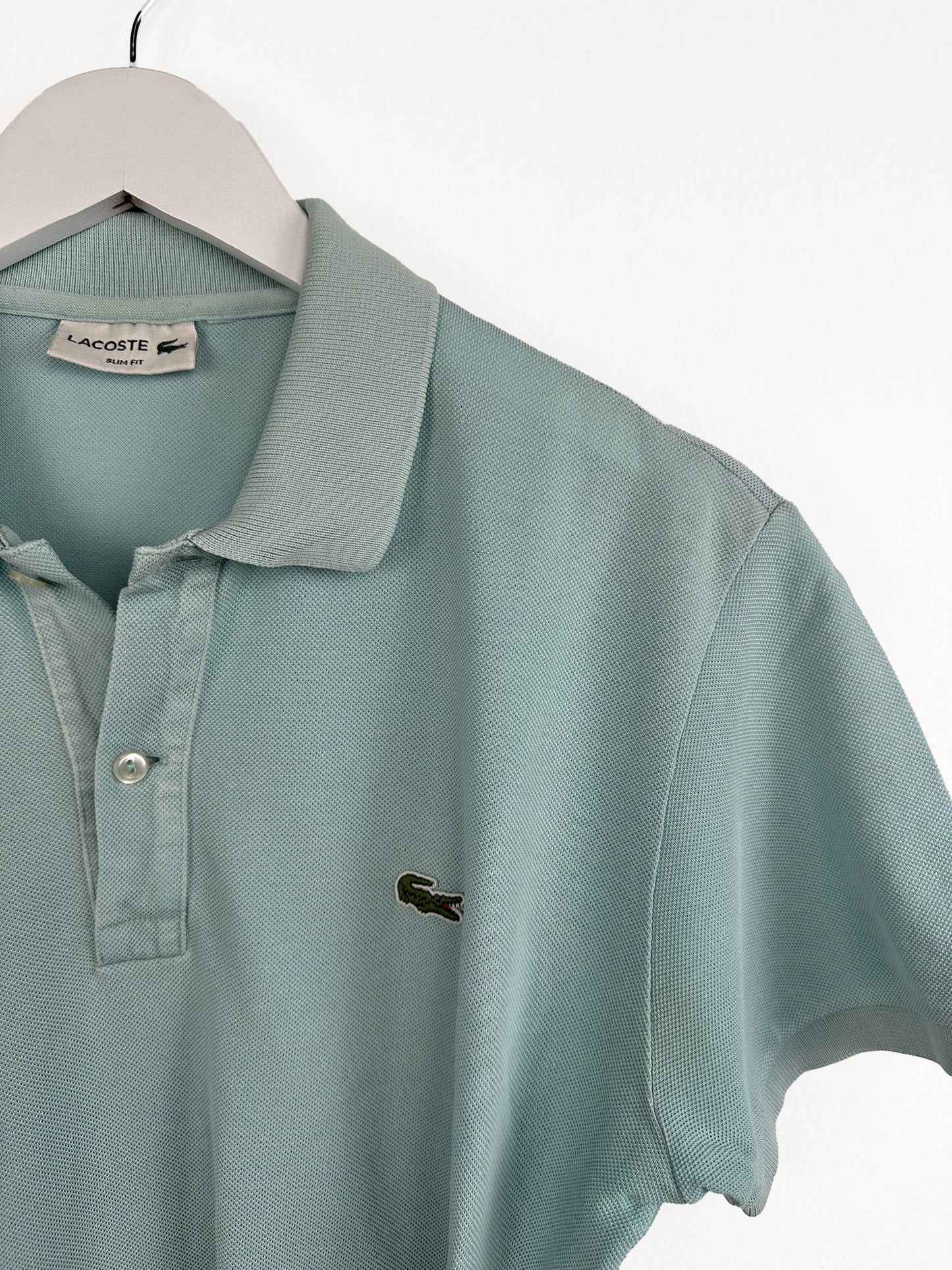 Polo Lacoste verde acqua (25p152) - M/L