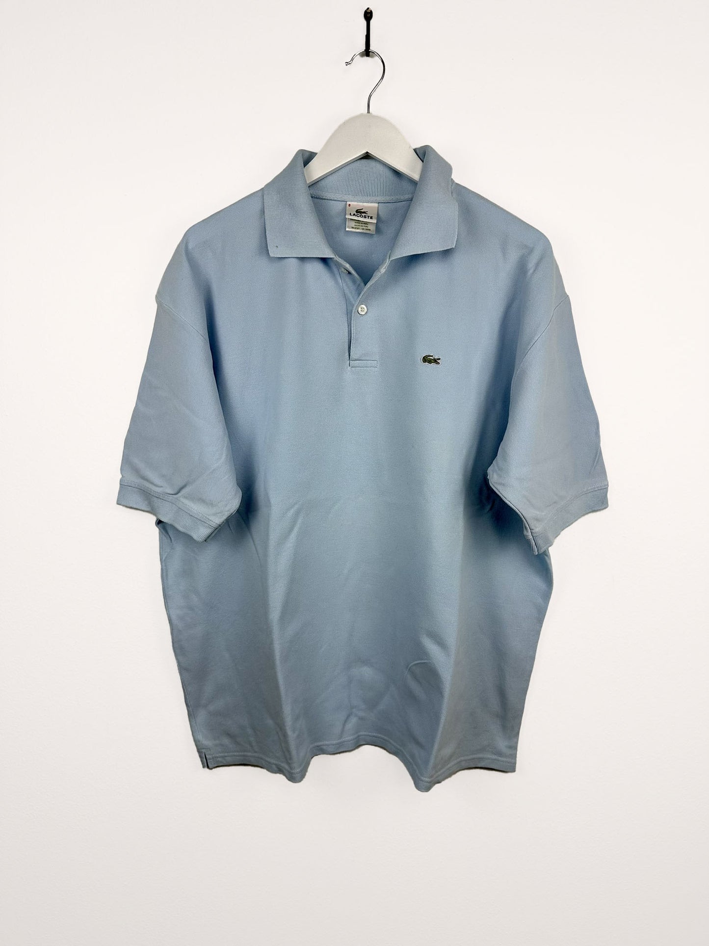Polo Lacoste azzurra (25p23) - XL