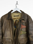 Giacca bomber in pelle Chevignon 90s marrone con patches (26g311) - L