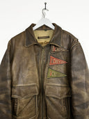 Giacca bomber in pelle Chevignon 90s marrone con patches (26g311) - L